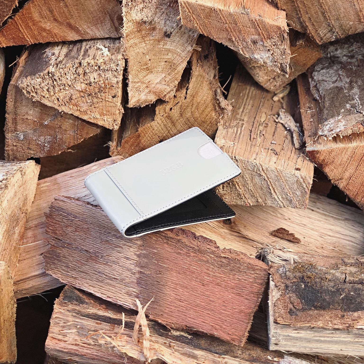 Wallet on stacked firewood