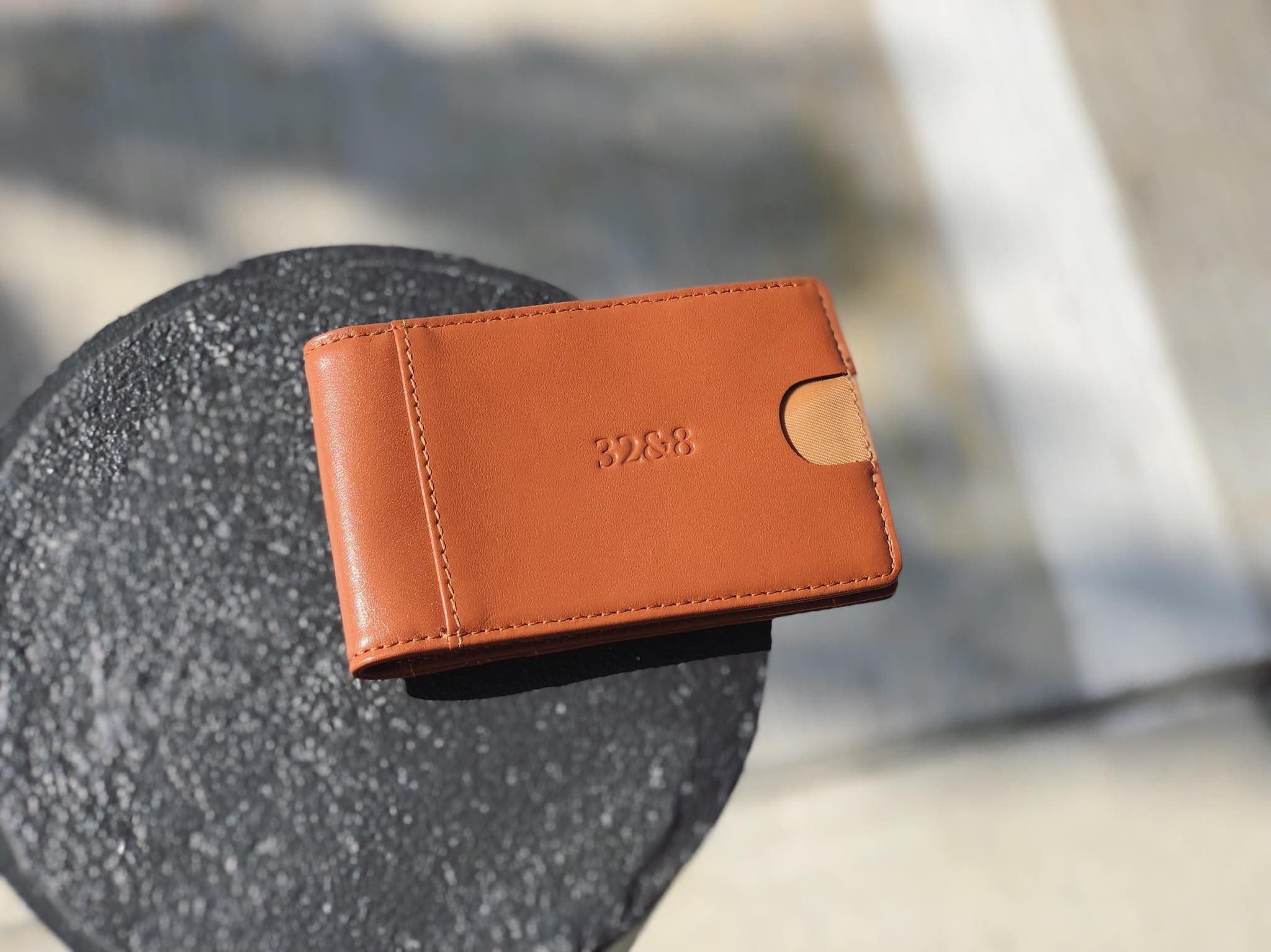 Cognac wallet on dark metal
